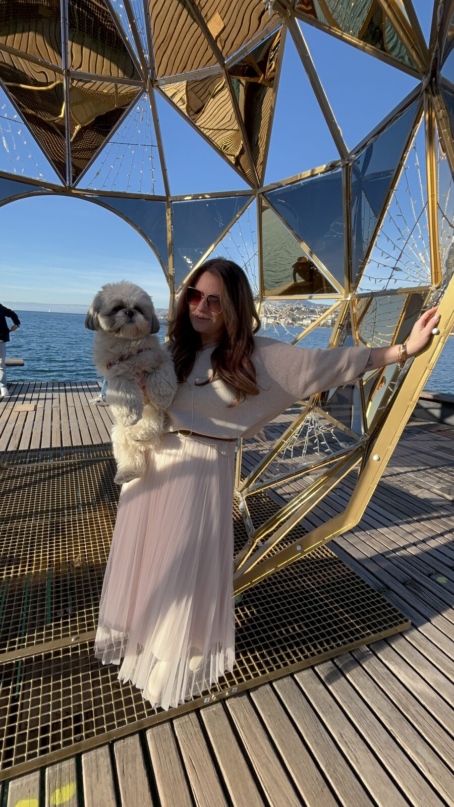 Pam and Daisy inside a giant golden bauble on the Montreux lakefront
